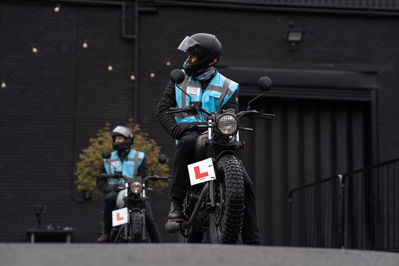 Learner rider completing CBT course with instructor