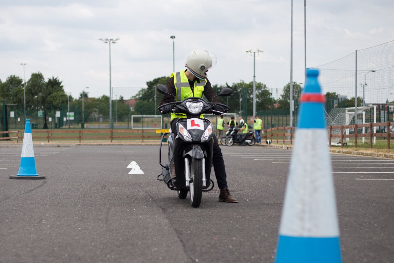 Learner rider on an L-plated scooter during CBT training